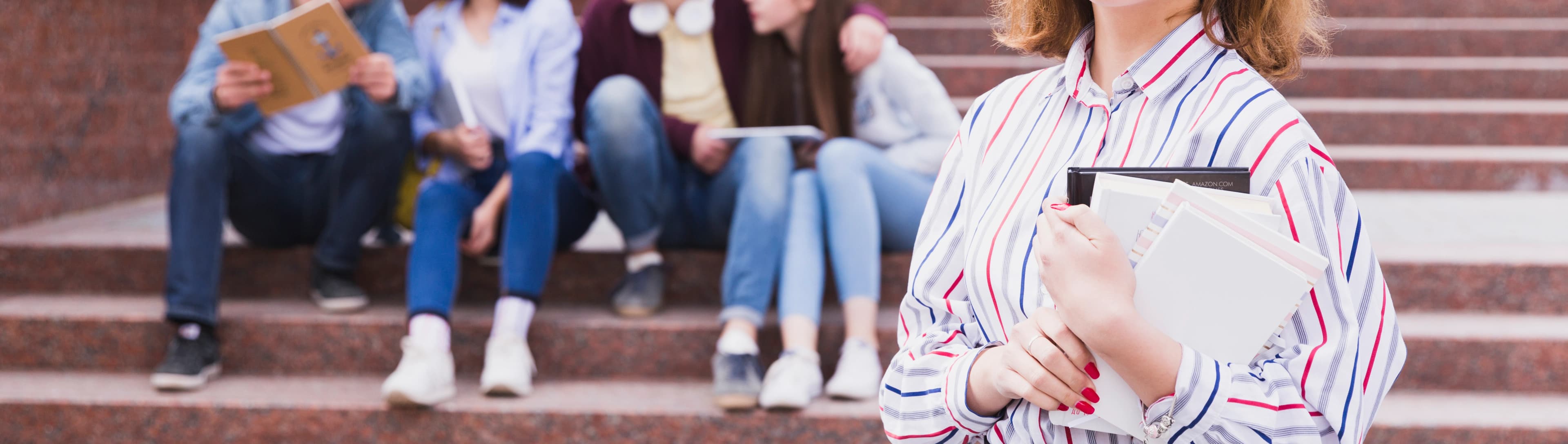 1765786453139-HERO-teenage-girl-standing-holding-notebook-hands.jpg