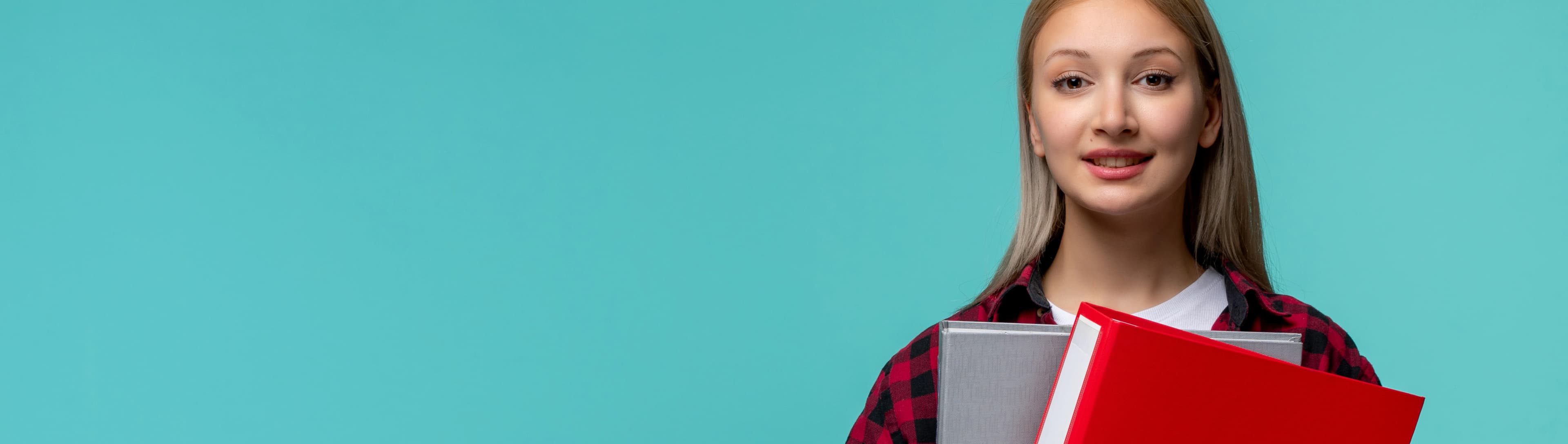 1765789010272-HERO-international-students-day-young-cute-girl-red-checked-shirt-happily-holding-file-folders.jpg